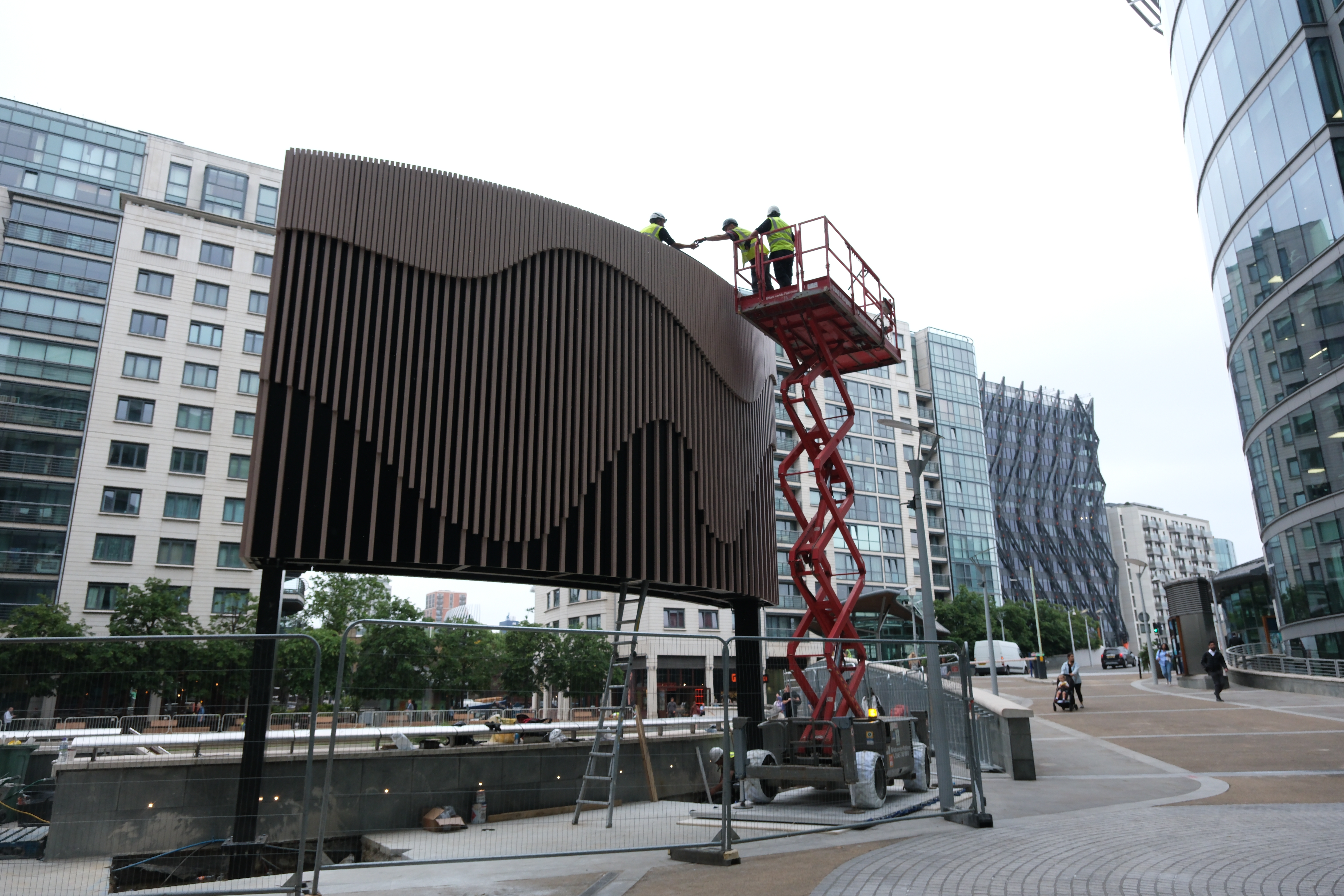 Workers install Large Digital screen in Paddington London